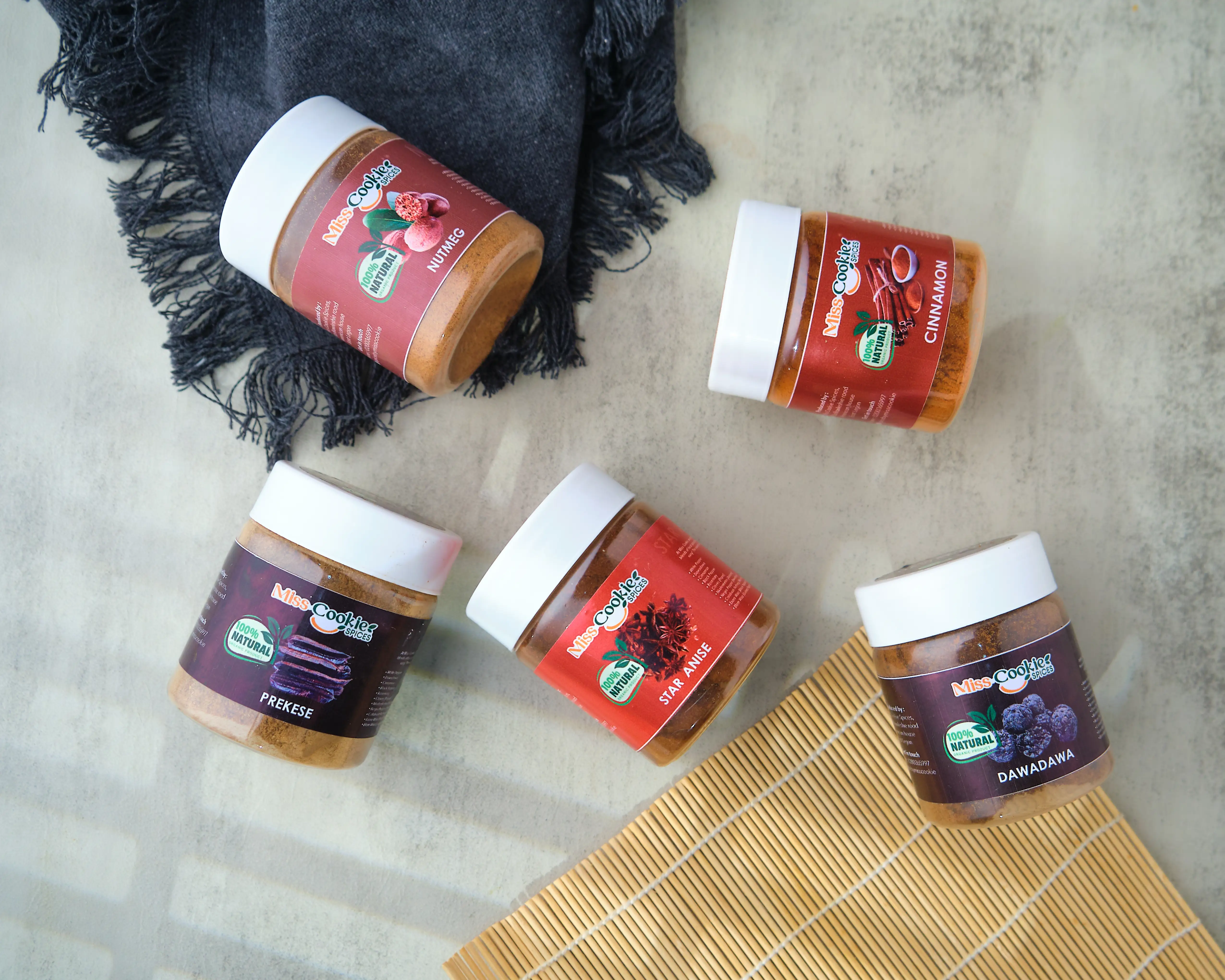 Five Miss Cookie jars: nutmeg, cinnamon, prekese, star anise and dawadawa